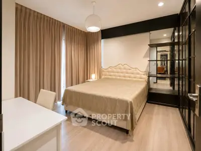 Luxurious bedroom with elegant decor and ample natural light