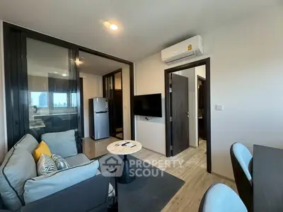 Modern living room with sleek design, featuring air conditioning and open layout for comfortable living.
