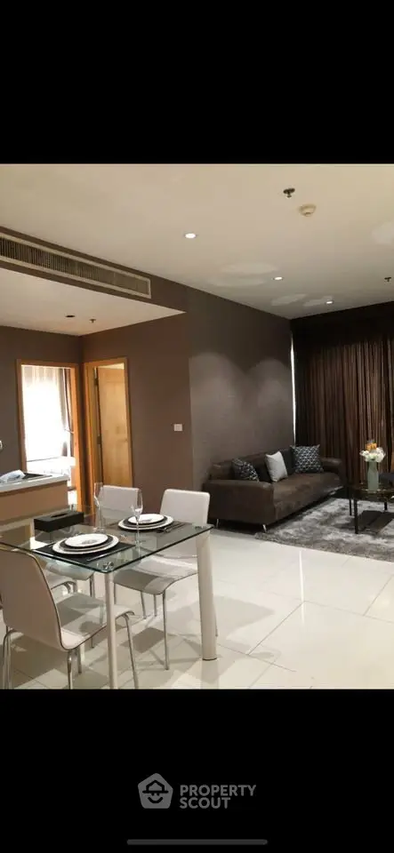 Modern living room with elegant dining area and stylish decor