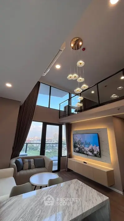 Luxurious modern living room with high ceilings and stunning city view from balcony.