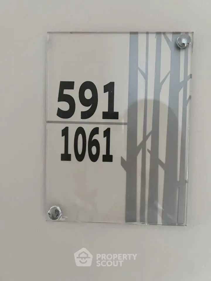 Modern apartment number sign with sleek design and clear numbering