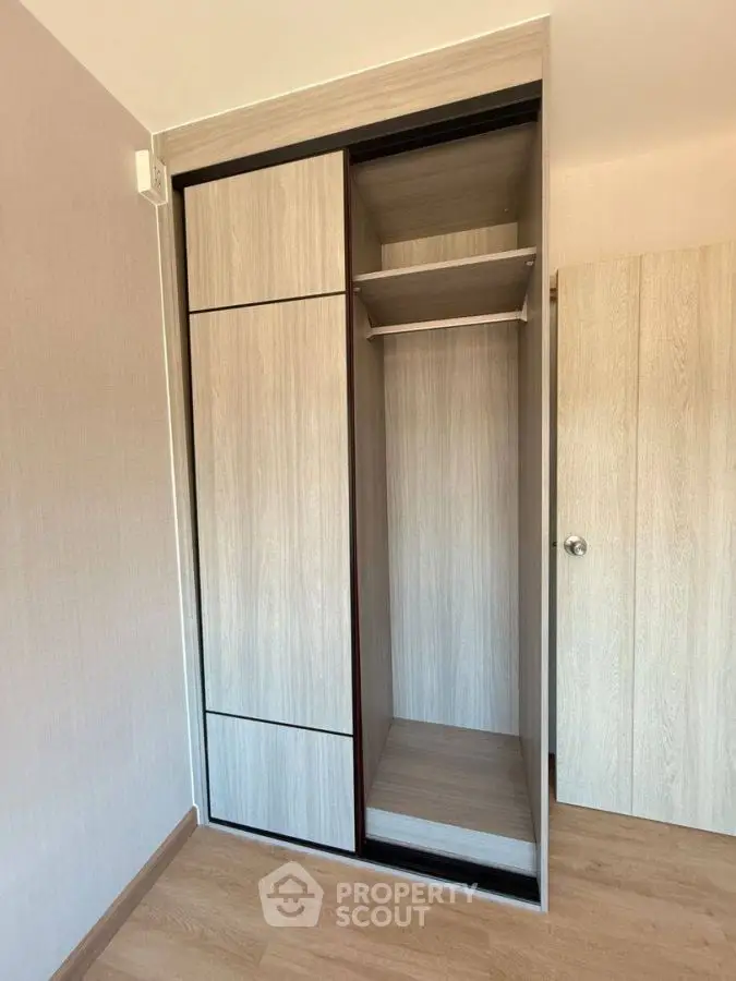 Modern built-in wardrobe with sliding doors in a stylish bedroom.