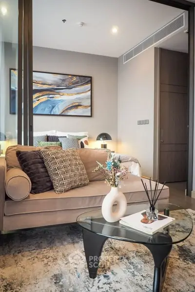Stylish modern living room with elegant decor and cozy seating area.