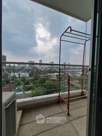 Spacious balcony with city view, perfect for relaxation and enjoying the skyline.