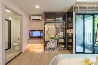 Stylish bedroom with modern closet and balcony access
