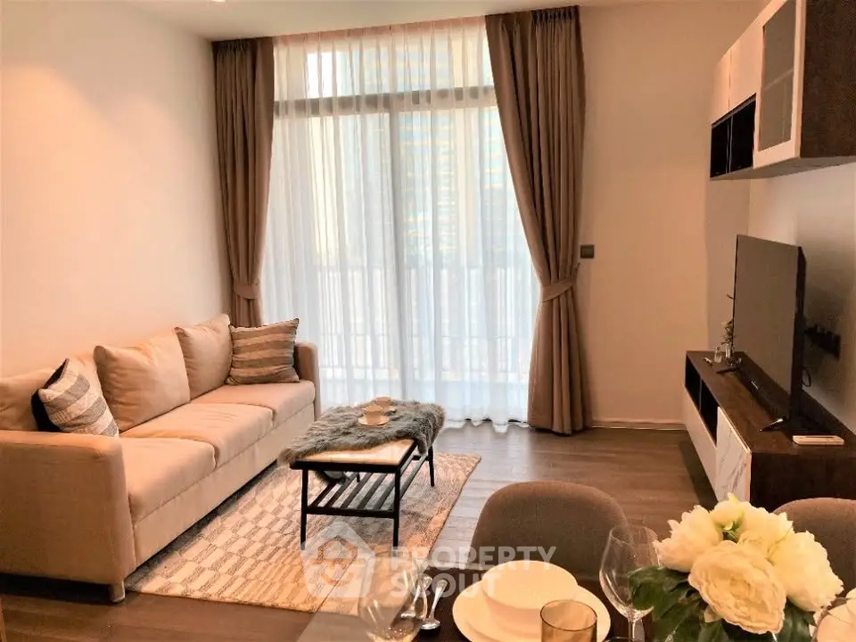 Stylish modern living room with cozy sofa and elegant decor in a high-rise apartment.