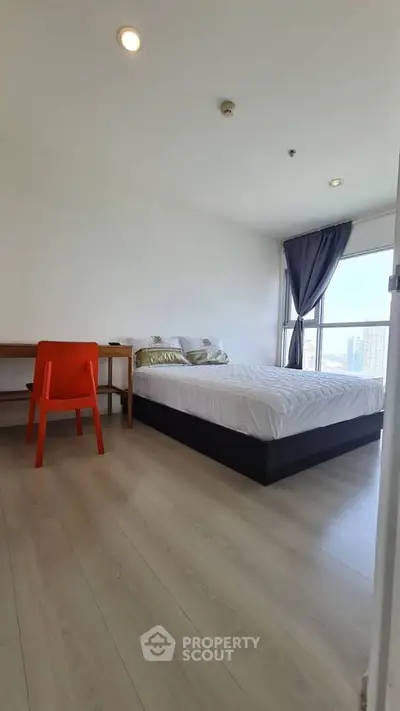 Bright modern bedroom with city view and minimalist decor