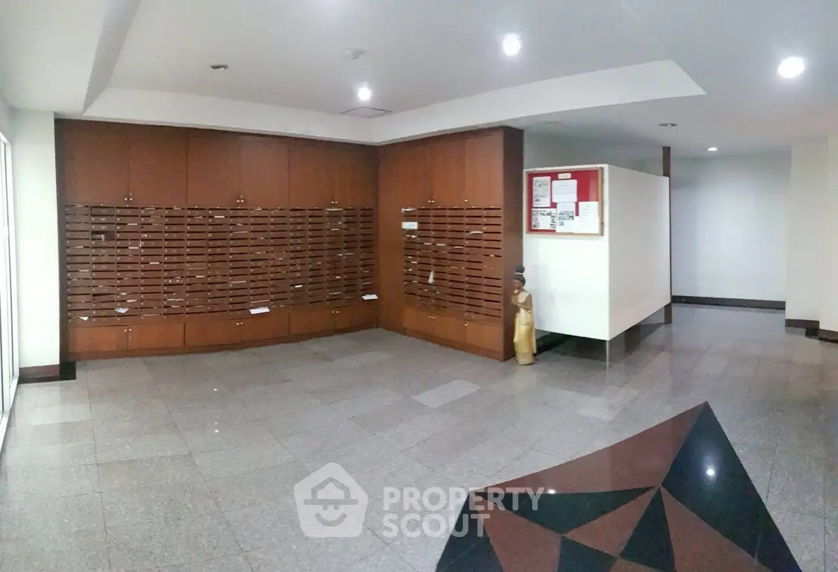 Spacious building lobby with mailboxes and modern design