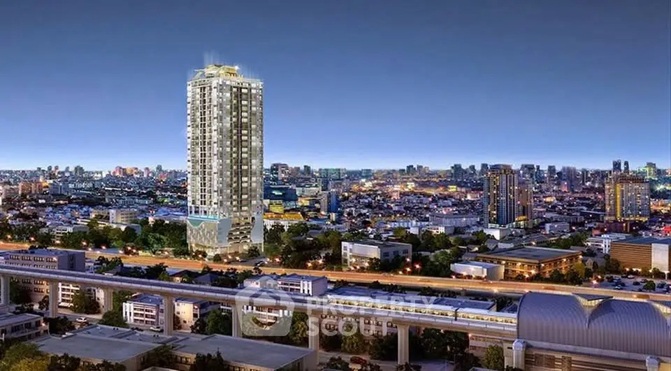 Stunning cityscape view with illuminated high-rise building at night, showcasing urban luxury living.