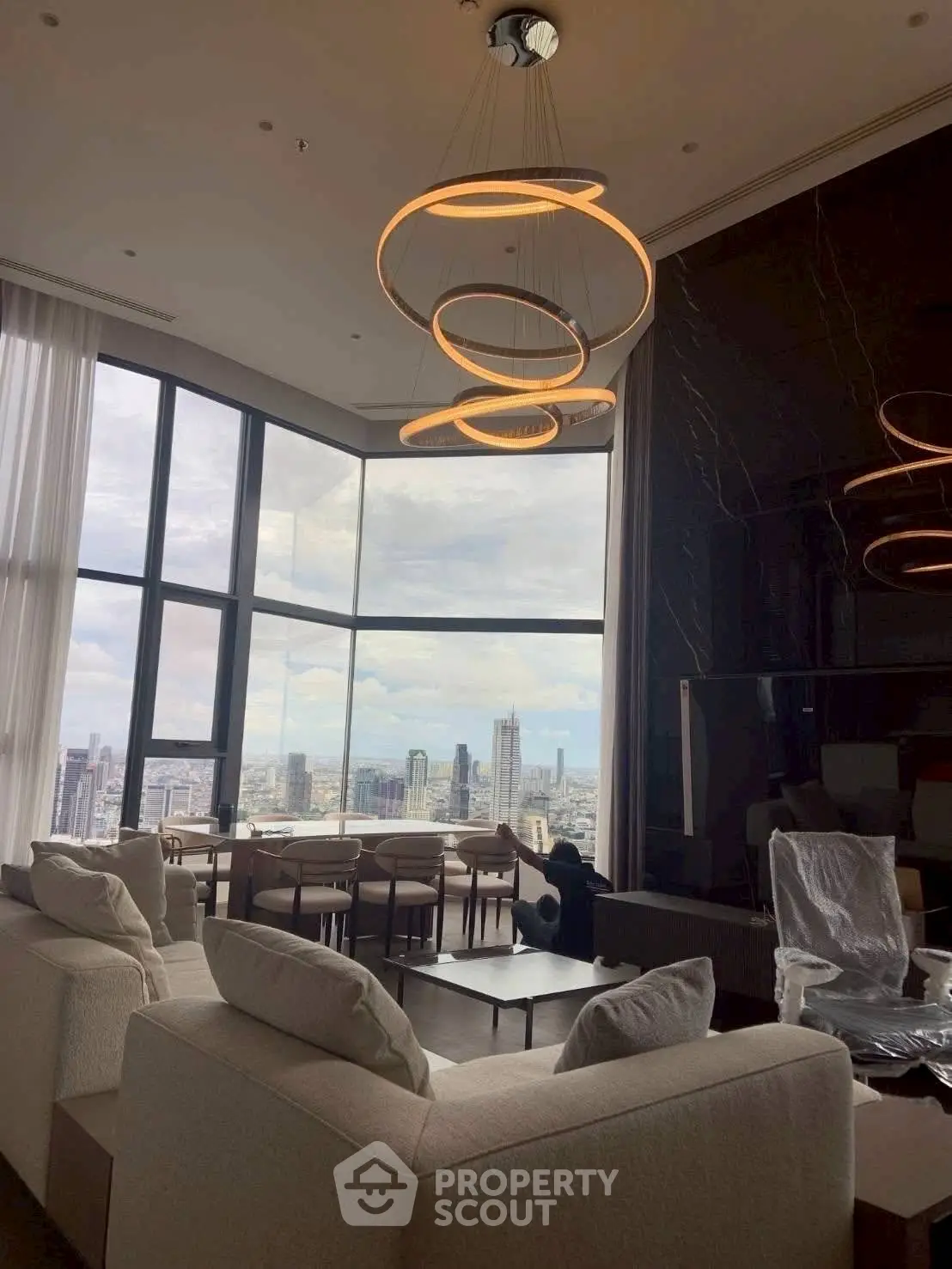 Luxurious living room with panoramic city view and modern lighting