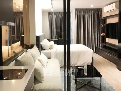 Modern studio apartment with cozy living area and sleek design