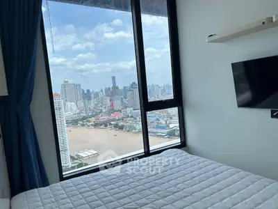Stunning bedroom with panoramic city view and modern decor