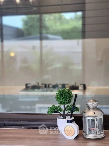 Charming kitchen view with modern gas stove and decorative accents.