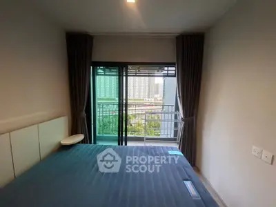 Modern bedroom with balcony view in urban apartment