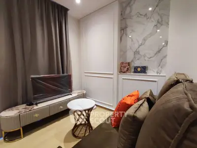 Stylish living room with modern decor and marble accents, perfect for urban living.