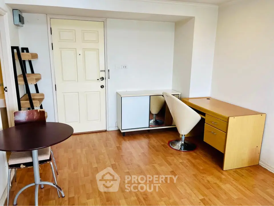 Chic study room with modern furniture and wooden flooring, perfect for productivity and style.