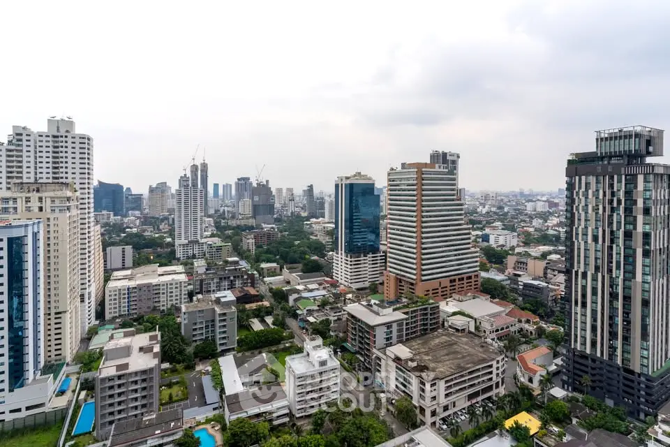 Stunning cityscape view showcasing modern high-rise buildings and lush greenery.