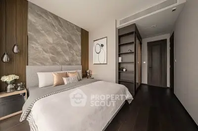 Modern bedroom with elegant decor and stylish furnishings, featuring a cozy bed and contemporary artwork.