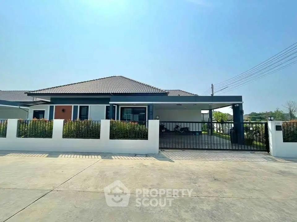 Charming single-story home with spacious driveway and modern design.