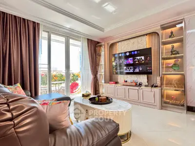 Luxurious living room with modern entertainment center and large windows opening to a balcony.