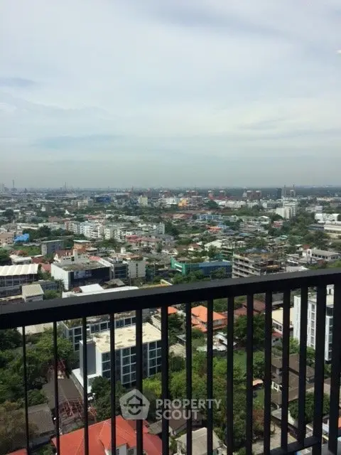 Stunning cityscape view from a high-rise balcony, showcasing urban living at its finest.