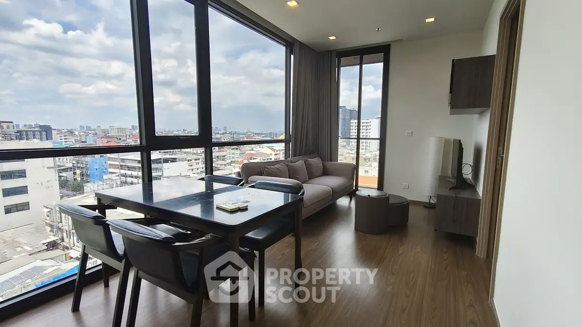 Modern living room with panoramic city view and stylish furniture