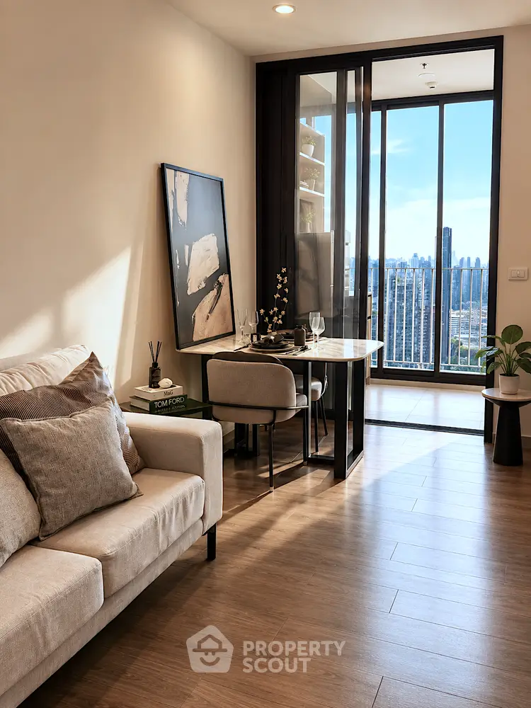 Modern living room with stylish decor and stunning city view from balcony.