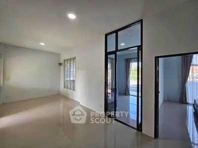 Spacious modern living area with large windows and sleek design