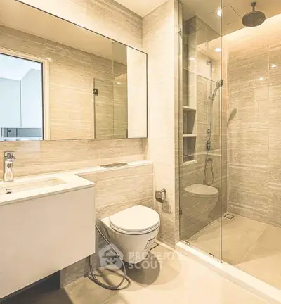 Luxurious modern bathroom with glass shower and sleek fixtures