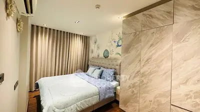 Cozy bedroom with elegant decor and ample storage space