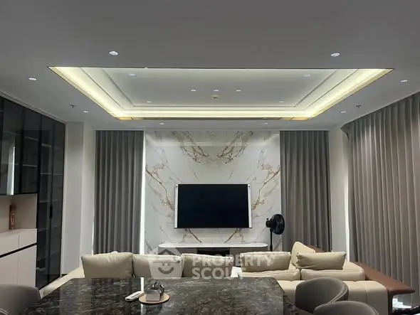 Luxurious modern living room with marble accent wall and elegant lighting