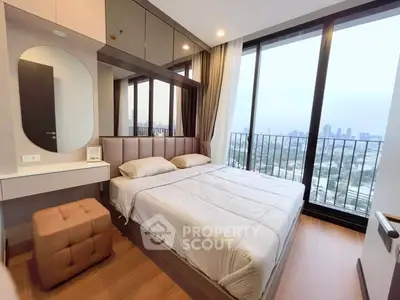 Modern bedroom with floor-to-ceiling windows and city view