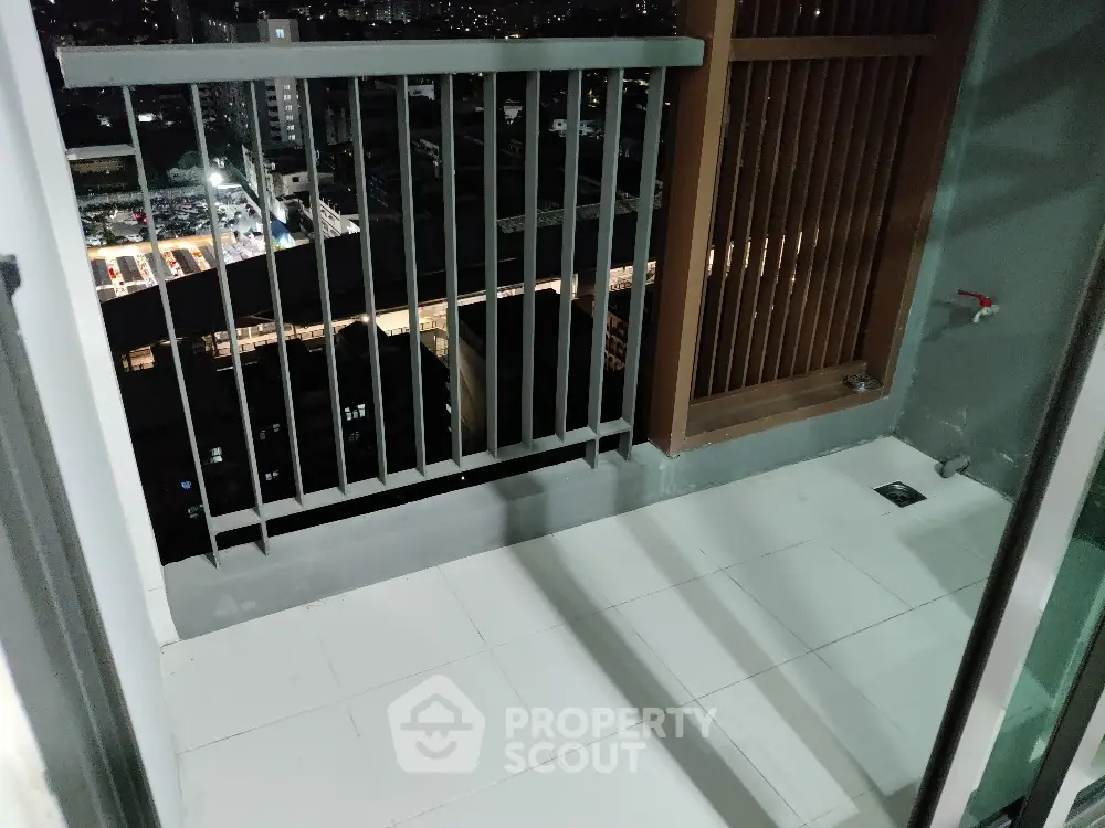 Modern apartment balcony with city view, perfect for urban living.