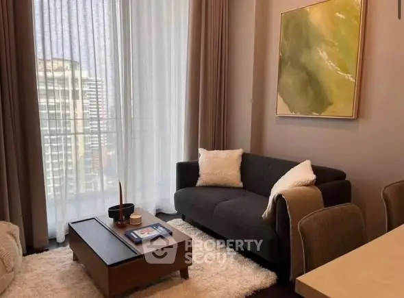 Stylish living room with modern decor and city view through large windows.