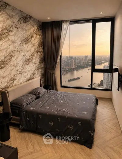 Luxurious bedroom with stunning river view and elegant decor