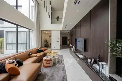 Luxurious modern living room with high ceilings and elegant decor