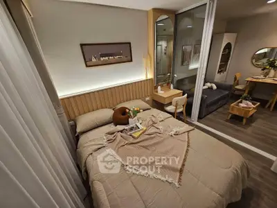 Cozy bedroom with modern decor and warm lighting, featuring a comfortable bed and stylish furnishings.