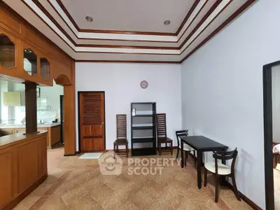 Spacious living room with elegant wooden accents and open layout, perfect for modern living.