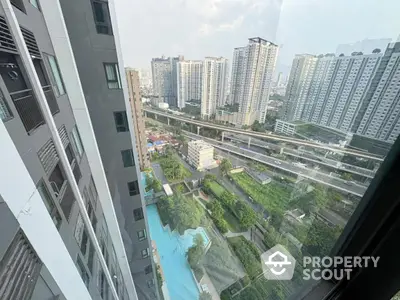 Stunning high-rise apartment view with pool and cityscape