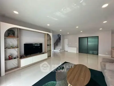 Spacious modern living room with sleek design and ample natural light