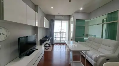 Modern living room with sleek furniture and city view balcony