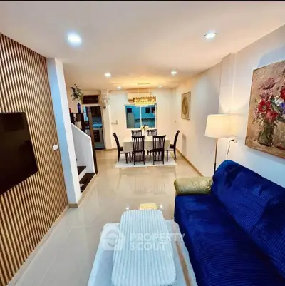 Spacious modern living room with elegant dining area and stylish decor
