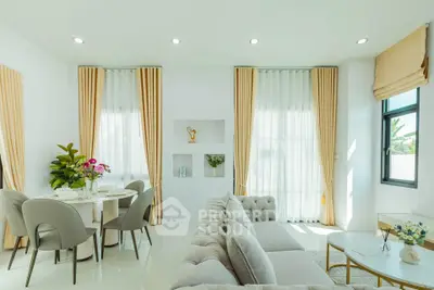 Elegant living room with modern decor and natural light