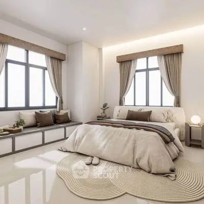Luxurious bedroom with elegant decor and large windows, featuring cozy seating and stylish lighting.