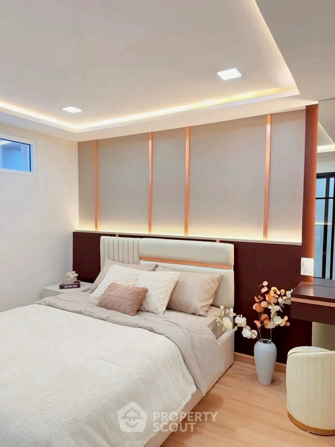 Elegant bedroom with modern lighting and cozy decor