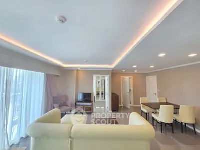 Spacious modern living room with elegant lighting and comfortable seating