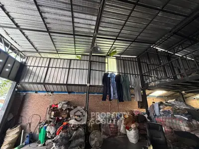 Spacious industrial warehouse with high ceilings and ample storage space.