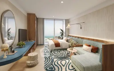 Luxurious bedroom with ocean view, modern decor, and stylish furniture in a high-end apartment.