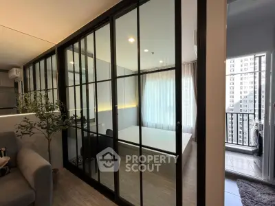 Modern apartment with glass partitioned bedroom and balcony view