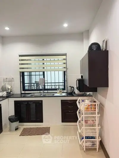 Modern kitchen with sleek cabinetry and ample storage space